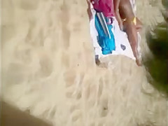 Mature beach voyeured topless (caught!)