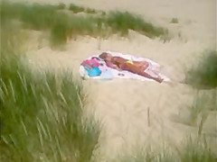 Mature beach voyeured topless (caught!)