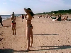 Lovely teens bare their bodies at a nudist beach