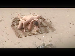 Voyeur on public beach. Hot young couple sex1