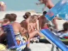 Nice young tits - beach voyeur video