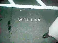 Lisa being pissed on in the car park outdoors.