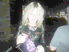 Lisa being pissed on in the car park outdoors.