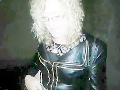 Lisa being pissed on in the car park outdoors.