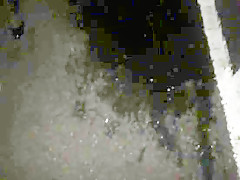 Lisa being pissed on in the car park outdoors.