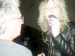 Lisa being pissed on in the car park outdoors.