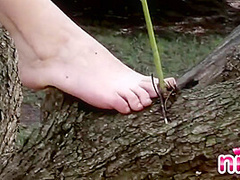 Hot lesbian in a tree touching herself