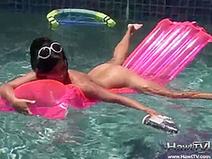 Babe on lilo naked in the sun