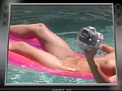 Babe on lilo naked in the sun