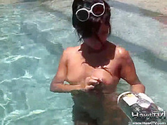 Babe on lilo naked in the sun