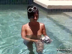 Babe on lilo naked in the sun