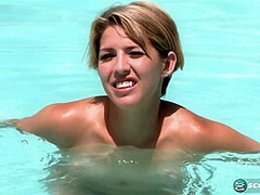 Aliha Aldamen tans her fair skin outside by the pool while wearing a blue and white striped bikini before masturbating on the deck.