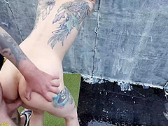 small ass stretched on a public rooftop
