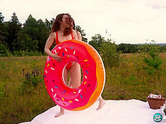 Margo Von Teese and Simona splash each other in their bikinis in a lake before eating each other out on the beach.