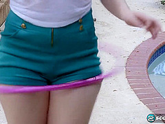 Lillith Adams shows off her Hula Hoop skills. Then, she swivels her hips on a stud's cock until he blasts her with a cum facial. - Lillith Adams and Juan Largo - NaughtyMag