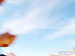 Busty bitch Domino walks on the beach and shows her boobs