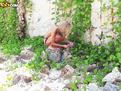 Sweet-looking blonde girl is banged on a beach