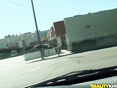 Britney Sanders drinking some coffee and having a ride through the town
