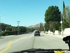 Britney Sanders drinking some coffee and having a ride through the town