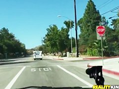 Britney Sanders drinking some coffee and having a ride through the town