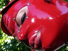 Latex Lucy in latex suit is fingering cunt