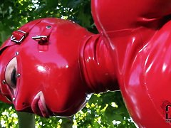 Latex Lucy in latex suit is fingering cunt