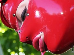 Latex Lucy in latex suit is fingering cunt