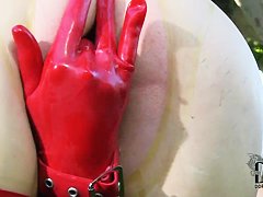 Latex Lucy in latex suit is fingering cunt