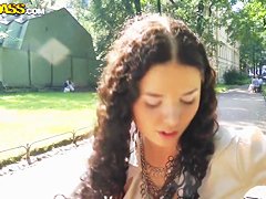 Cute curly brunette Leonora shows her boobs in park