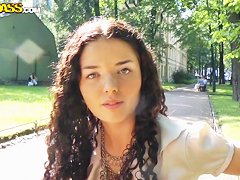 Cute curly brunette Leonora shows her boobs in park