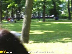 Cute curly brunette Leonora shows her boobs in park