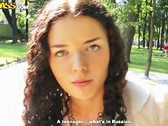 Cute curly brunette Leonora shows her boobs in park