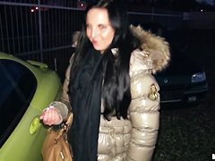 A young girl is offered cash for sex in a lot