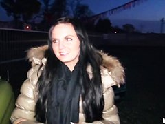 A young girl is offered cash for sex in a lot