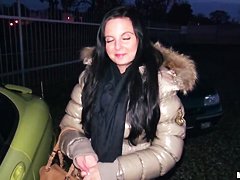 A young girl is offered cash for sex in a lot