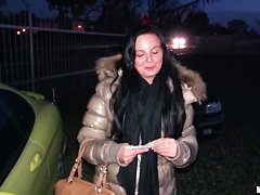 A young girl is offered cash for sex in a lot