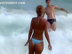 Girl with a sexy bikini enters the water