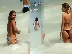Girl with a sexy bikini enters the water