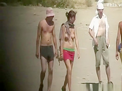 Topless girl caught by voyeur