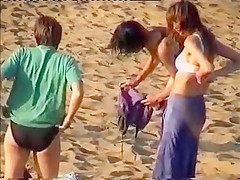 Nudist family leaving the beach