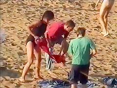 Nudist family leaving the beach