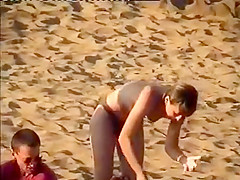 Nudist family leaving the beach