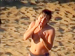 Nudist family leaving the beach