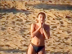 Nudist family leaving the beach