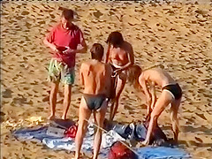 Nudist family leaving the beach