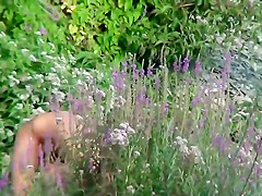 Naturist girl with a fully shaved head