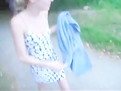 German girl does blowjob outside at parking area.