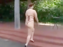 Japanese babe in skimpy purple bikini