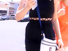 Girls defiles on the street showing off their asses