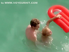 Guy trying to fuck her in the water